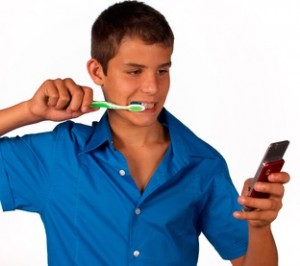Teenager texting even when brushing teeth, cellphone addiction